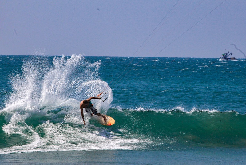 Advance Waveriding kitesurfer riding a left wave in Peru