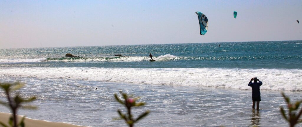 Kitesurfer riding a wave in Cabo Blanco Peru