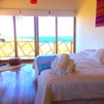 Ocean view king size bedroom at Surf Racer Peru