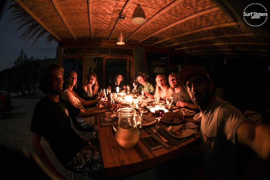 Christmas dinner celebration with staff and guest in surf racer camp peru